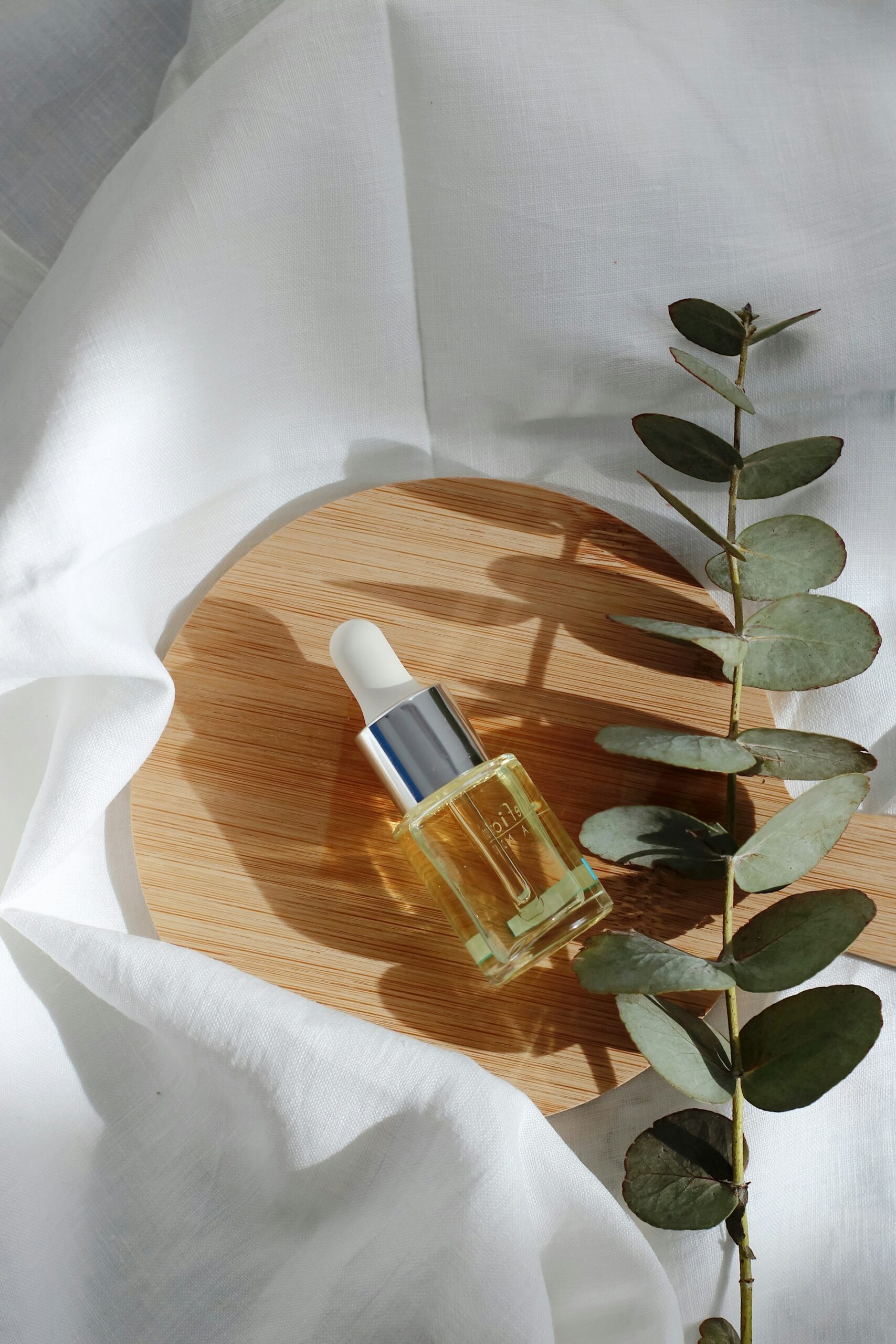clear glass bottle on a wooden board